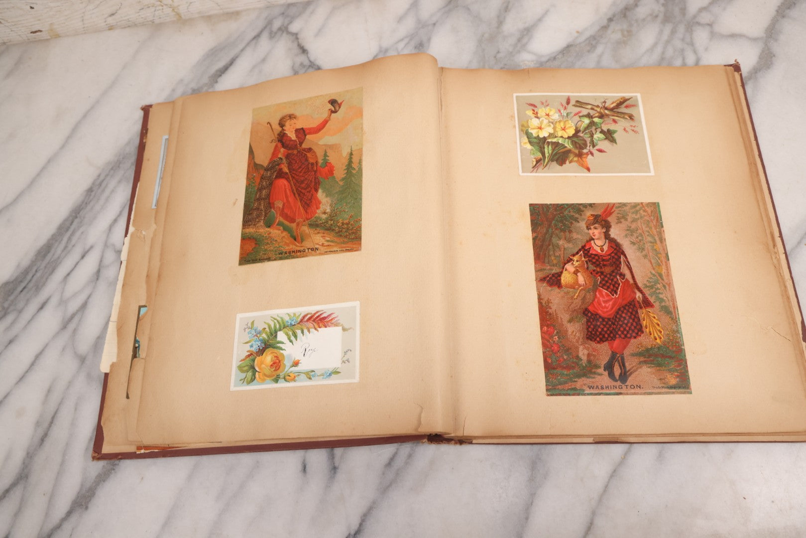Lot 114 - Antique Victorian Scrapbook Album With Textured Urns On Cover Containing 70+ Pieces Including Trade Cards, Die Cuts, Calling Cards, And Other Scraps