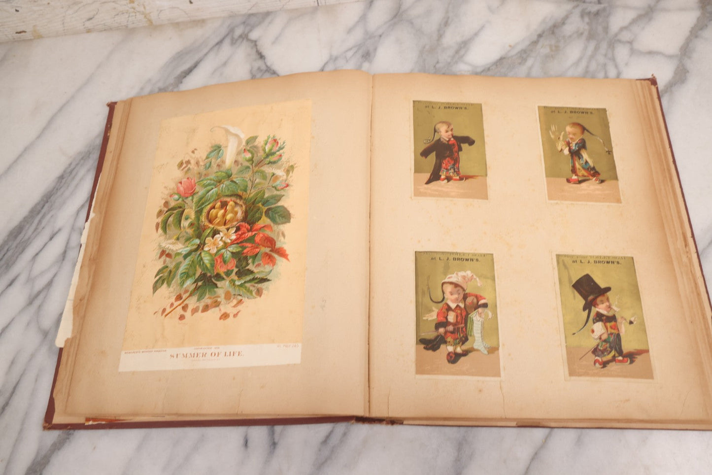 Lot 114 - Antique Victorian Scrapbook Album With Textured Urns On Cover Containing 70+ Pieces Including Trade Cards, Die Cuts, Calling Cards, And Other Scraps