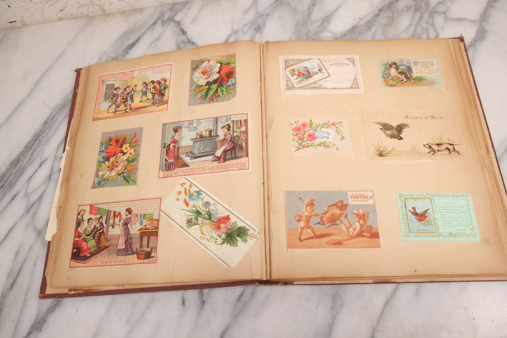 Lot 114 - Antique Victorian Scrapbook Album With Textured Urns On Cover Containing 70+ Pieces Including Trade Cards, Die Cuts, Calling Cards, And Other Scraps