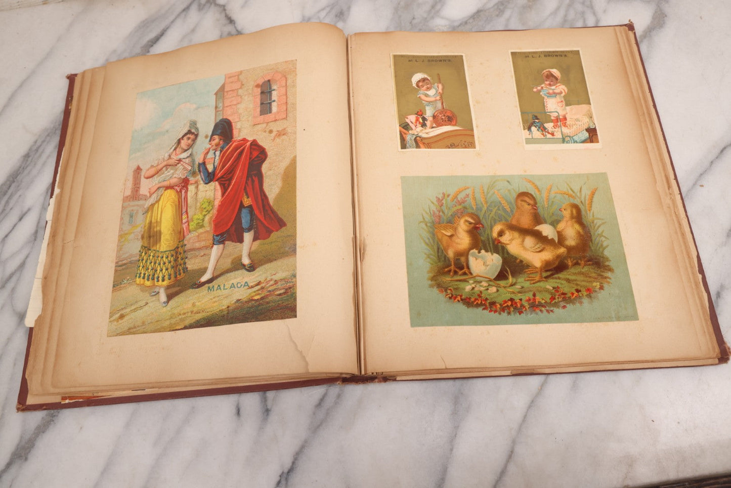 Lot 114 - Antique Victorian Scrapbook Album With Textured Urns On Cover Containing 70+ Pieces Including Trade Cards, Die Cuts, Calling Cards, And Other Scraps