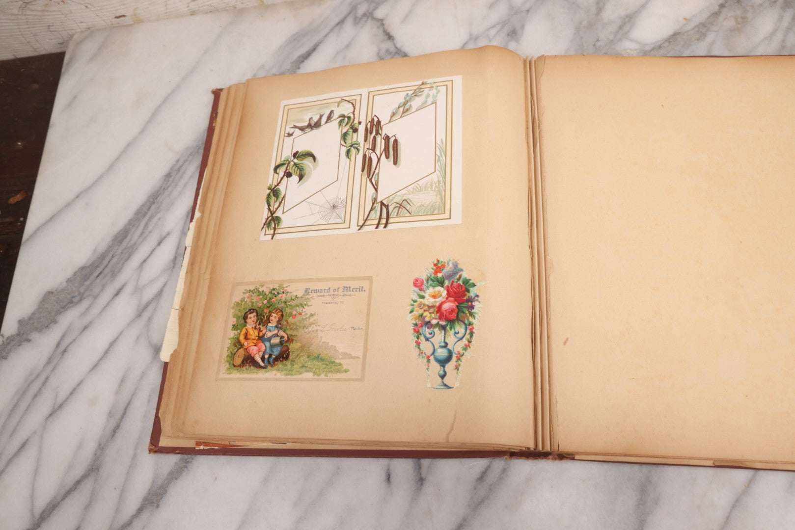 Lot 114 - Antique Victorian Scrapbook Album With Textured Urns On Cover Containing 70+ Pieces Including Trade Cards, Die Cuts, Calling Cards, And Other Scraps