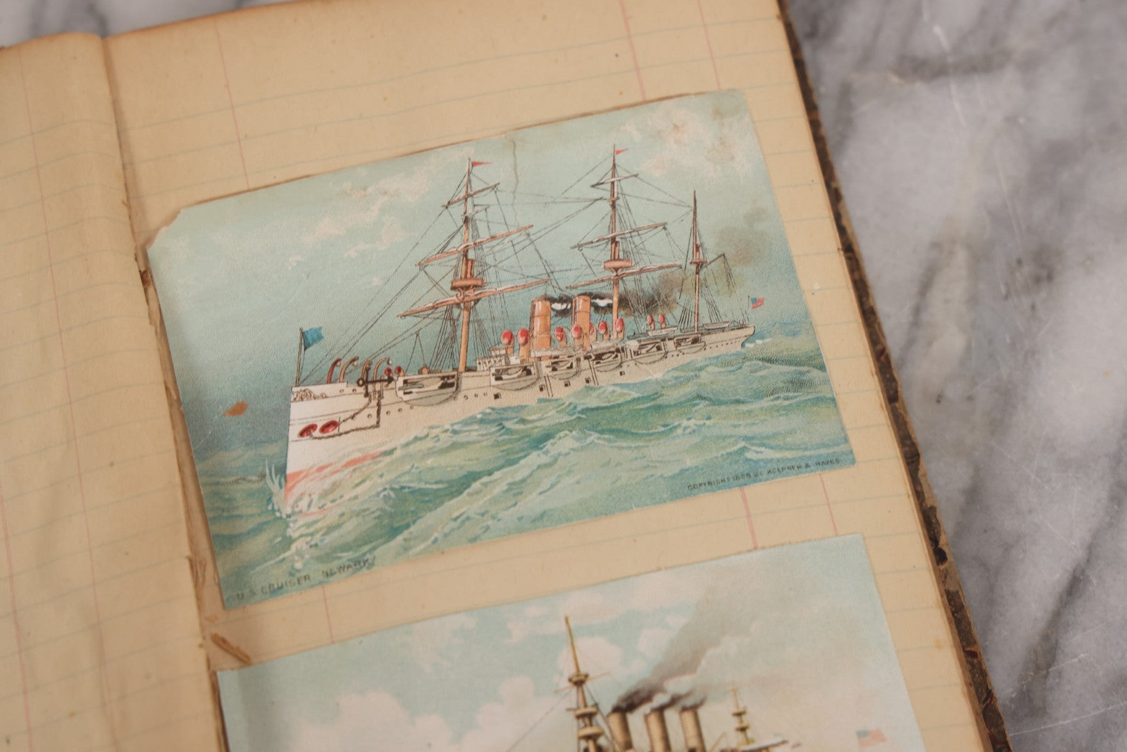 Lot 118 - Antique Scrapbook Album Made From An Old Cash Book Ledger Containing 15 Lithographed Card Featuring United States Battleships Of The Spanish American War Era, Cards Copyright 1898 By Koerner & Hayes, With Four Additional Cards, Doodles, Etc.