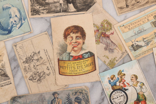 Lot 131 - Grouping Of Fifteen Antique Lithographed Trade Cards Cut From Scrap Albums, Including Petit's Eye Salve, Others, Note All Have Paper Pasted To Backs
