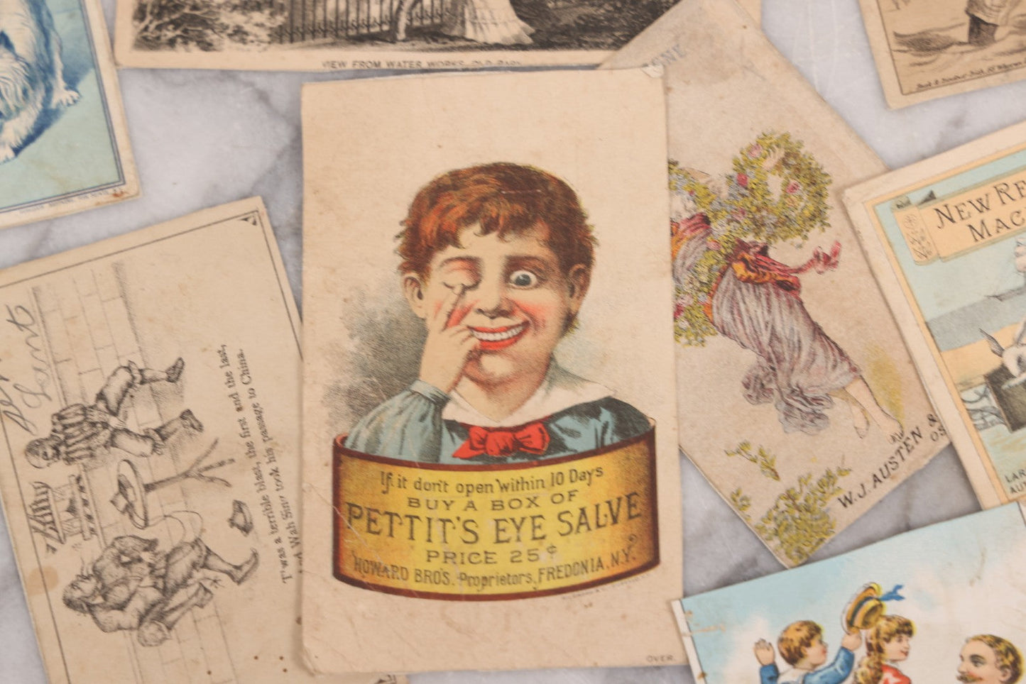 Lot 131 - Grouping Of Fifteen Antique Lithographed Trade Cards Cut From Scrap Albums, Including Petit's Eye Salve, Others, Note All Have Paper Pasted To Backs