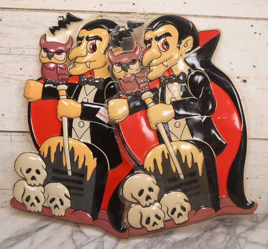 Lot 151 - Pair Of Vintage Plastic Halloween Decorations Depicting Dracula With Gravestone, Owl, Skulls, And Bat, Made In China For Advance International Inc., Bronz, New York, Style No. W006, Copyright 1994, 13-1/8" x 20-1/4" Each