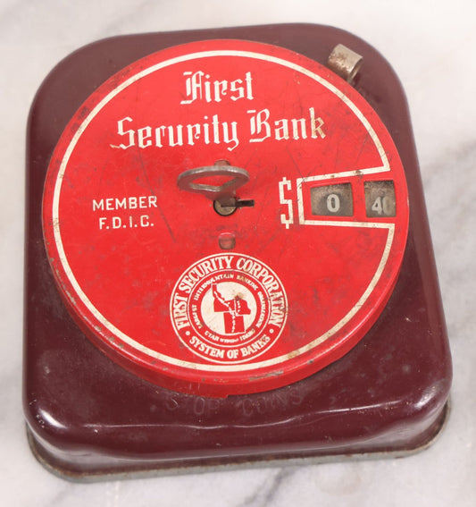 Lot 153 - Vintage First Security Bank Red Painted Metal Mechanical Coin Bank, "Member F.D.I.C." With First Security Corporation System Of Banks Logo "Largest Intermountain Banking Organization... Utah Wyoming Idaho"