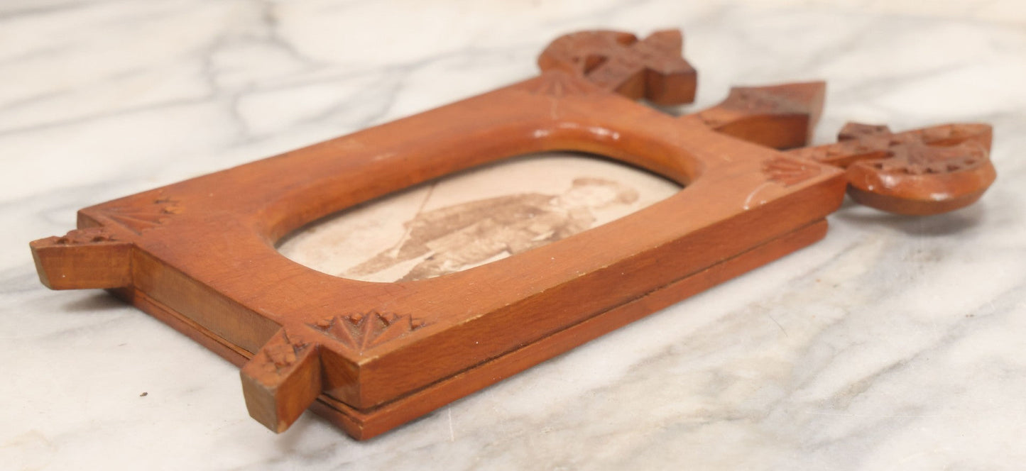 Lot 083 - Antique Folk Art Hand Carved Wooden Photo Frame With Crossed Axes, Spear Motifs, With Cabinet Card Photo Of Little Boy