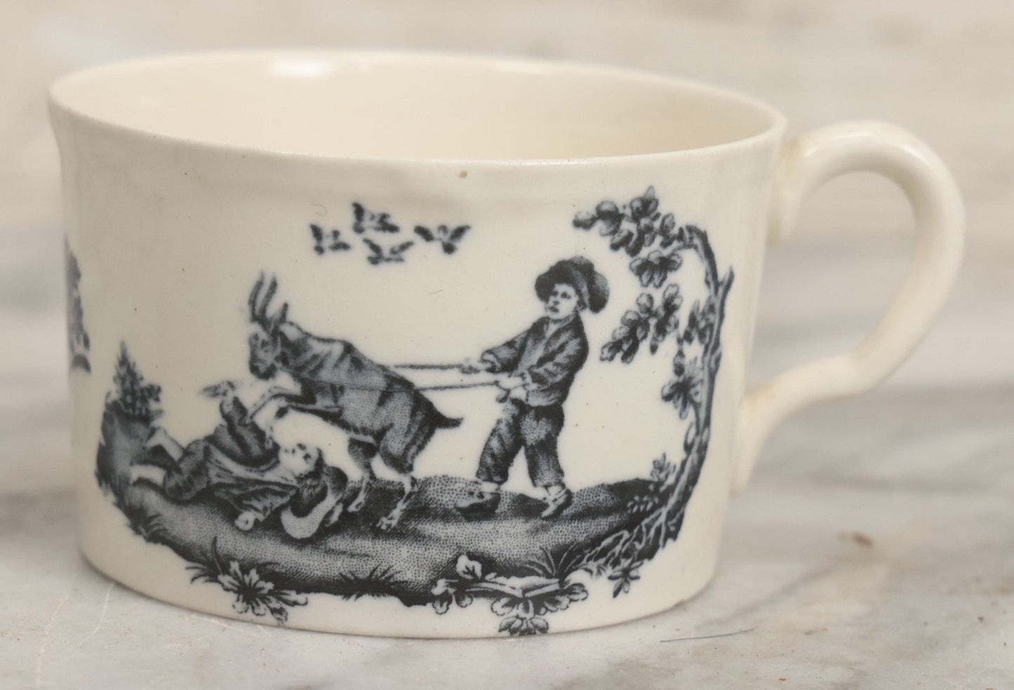 Lot 101 - Antique Transferware Children's Teacup With Scene Of Boys And Goat, Personages Line, Wedgwood, Etruria, England