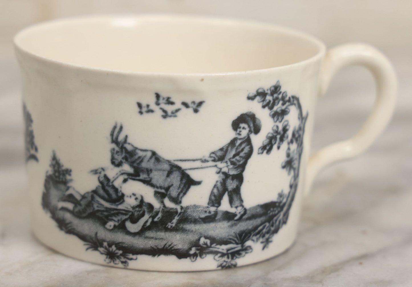 Lot 101 - Antique Transferware Children's Teacup With Scene Of Boys And Goat, Personages Line, Wedgwood, Etruria, England