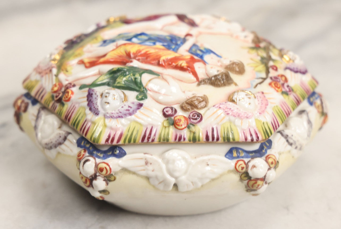 Lot 105 -  Vintage Capodimonte Style Porcelain Lidded Box With Three Graces Relief And Cherub Masks