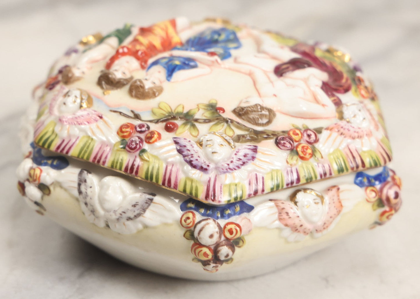 Lot 105 -  Vintage Capodimonte Style Porcelain Lidded Box With Three Graces Relief And Cherub Masks