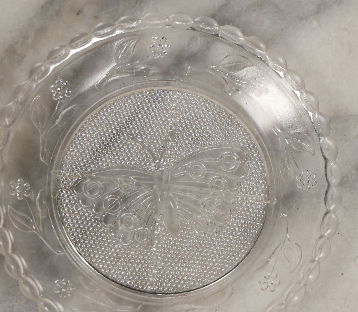 Lot 111 - Grouping Of Three Antique Pressed Glass Butterfly Cup Plate Coasters