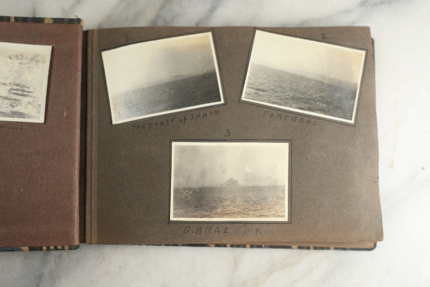 Lot 113 - Antique Snapshot Photo Album With Cloth Cover, Containing Approximately 75 Photographs With Captions, Mostly Of Travel, Including To Sea Travel, Locations In Asia, Sail Boats In Suez Canal, Singapore, Hong Kong, And More, Circa 1920s