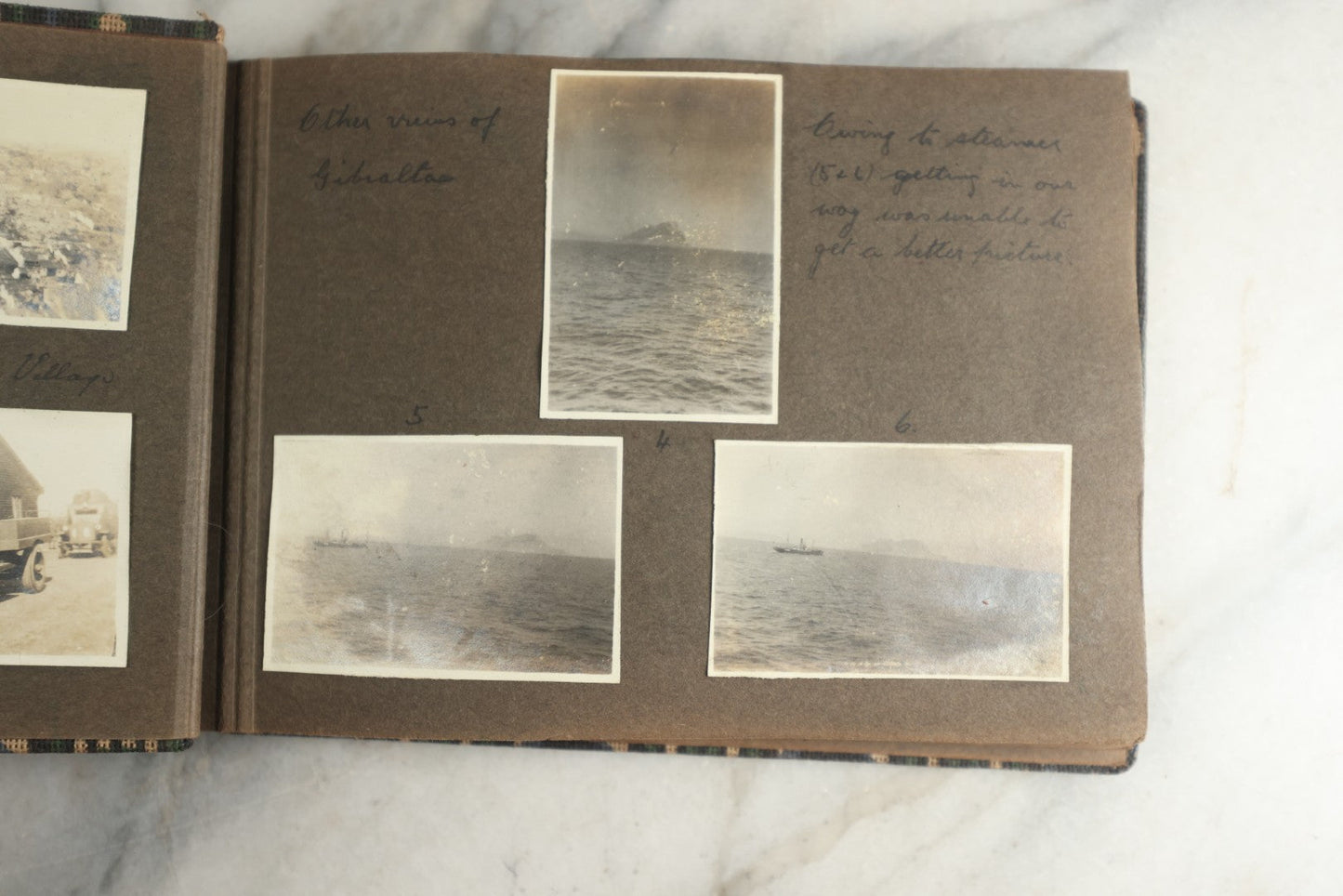 Lot 113 - Antique Snapshot Photo Album With Cloth Cover, Containing Approximately 75 Photographs With Captions, Mostly Of Travel, Including To Sea Travel, Locations In Asia, Sail Boats In Suez Canal, Singapore, Hong Kong, And More, Circa 1920s