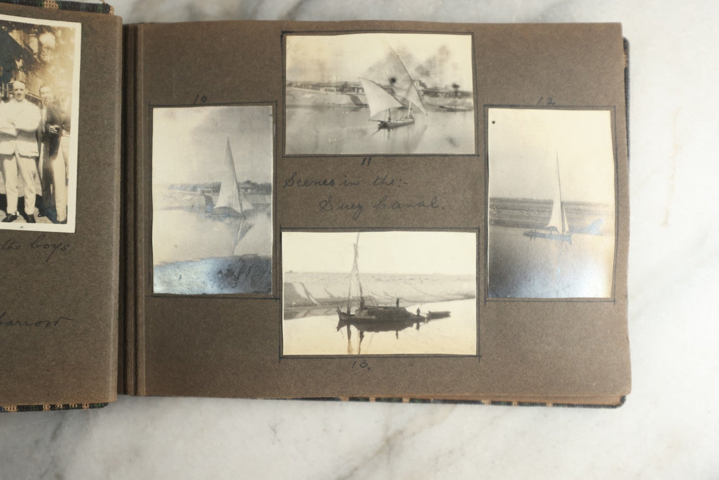 Lot 113 - Antique Snapshot Photo Album With Cloth Cover, Containing Approximately 75 Photographs With Captions, Mostly Of Travel, Including To Sea Travel, Locations In Asia, Sail Boats In Suez Canal, Singapore, Hong Kong, And More, Circa 1920s