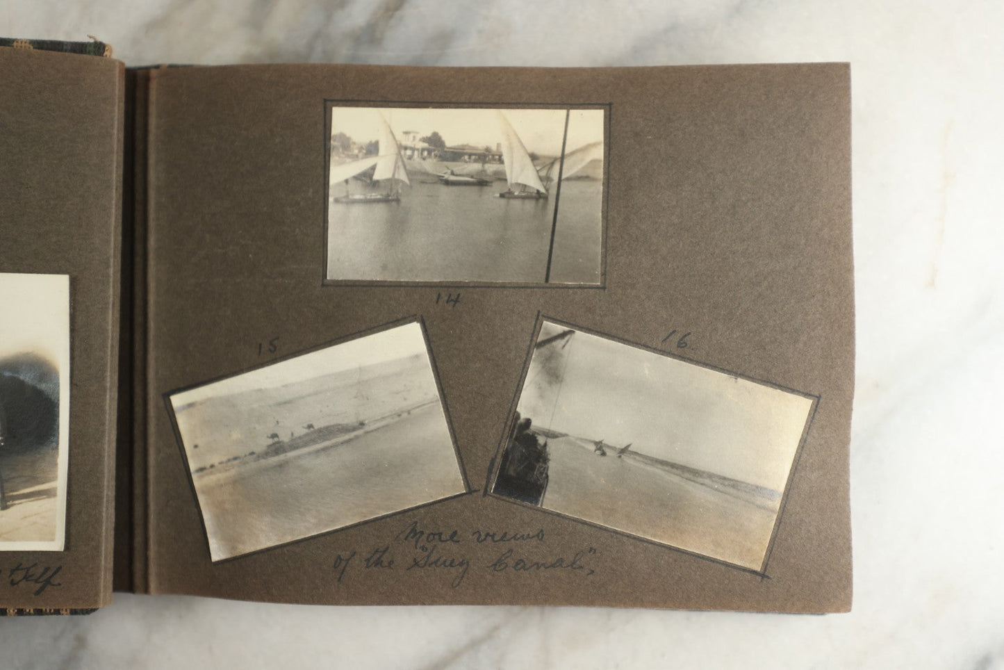 Lot 113 - Antique Snapshot Photo Album With Cloth Cover, Containing Approximately 75 Photographs With Captions, Mostly Of Travel, Including To Sea Travel, Locations In Asia, Sail Boats In Suez Canal, Singapore, Hong Kong, And More, Circa 1920s