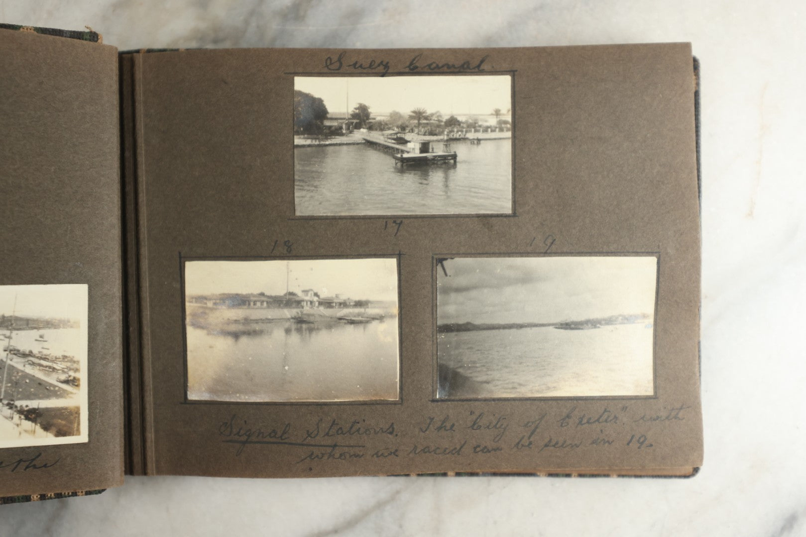 Lot 113 - Antique Snapshot Photo Album With Cloth Cover, Containing Approximately 75 Photographs With Captions, Mostly Of Travel, Including To Sea Travel, Locations In Asia, Sail Boats In Suez Canal, Singapore, Hong Kong, And More, Circa 1920s