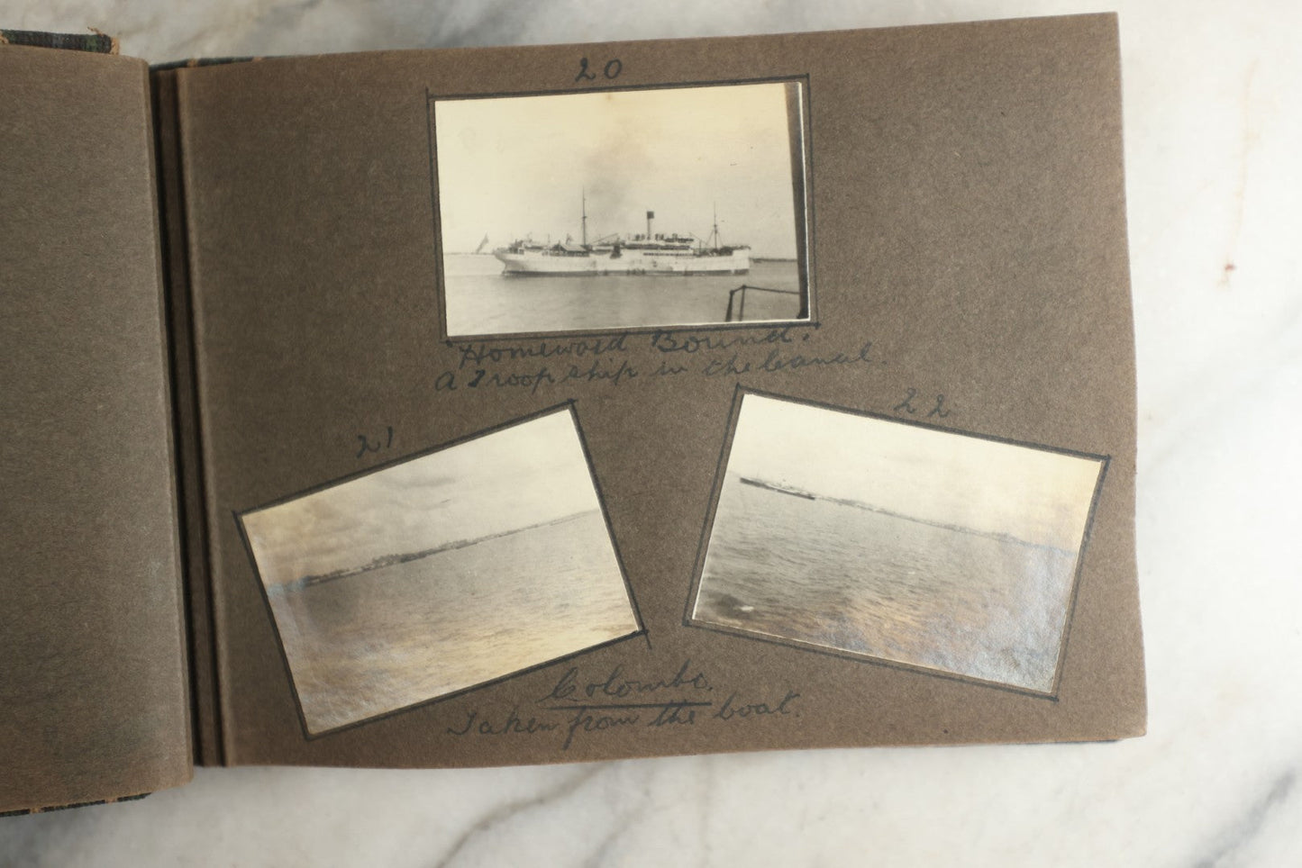 Lot 113 - Antique Snapshot Photo Album With Cloth Cover, Containing Approximately 75 Photographs With Captions, Mostly Of Travel, Including To Sea Travel, Locations In Asia, Sail Boats In Suez Canal, Singapore, Hong Kong, And More, Circa 1920s