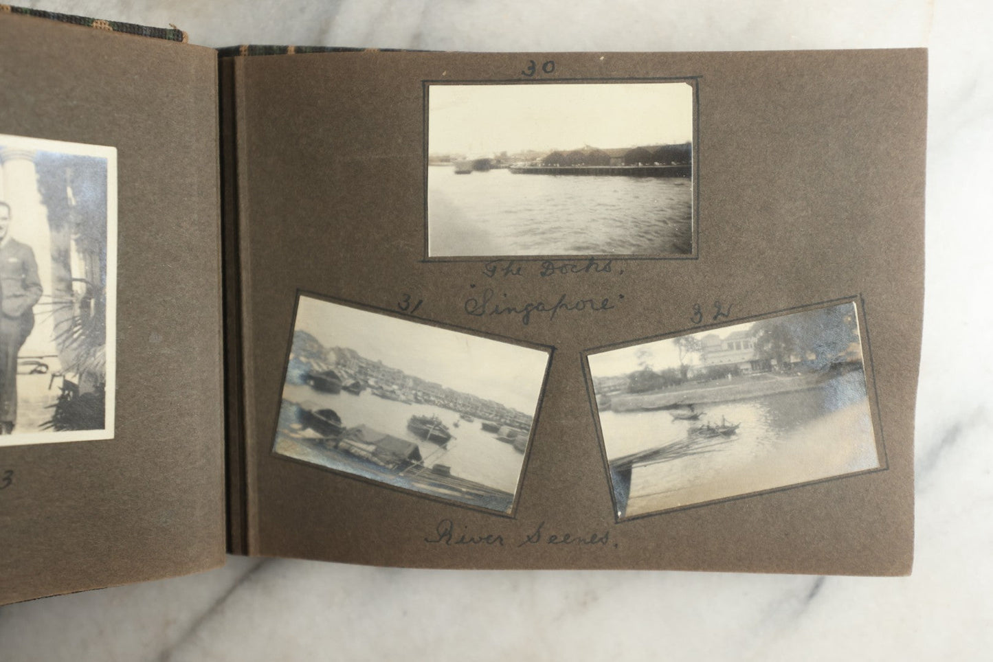 Lot 113 - Antique Snapshot Photo Album With Cloth Cover, Containing Approximately 75 Photographs With Captions, Mostly Of Travel, Including To Sea Travel, Locations In Asia, Sail Boats In Suez Canal, Singapore, Hong Kong, And More, Circa 1920s