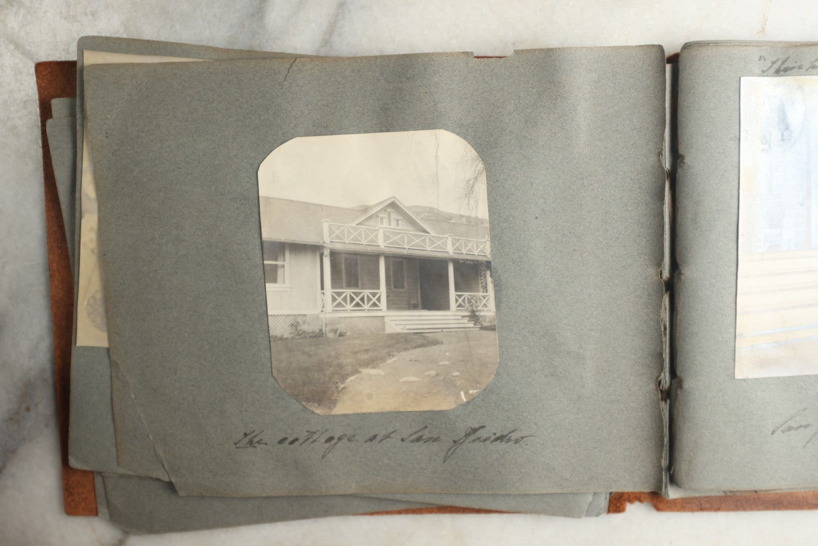 Lot 114 - Antique Snapshot Photo Album With Leather Southwestern Cover, Containing Approximately 50 Photographs With Captions, Mostly Of Travel, Including To Japan, Asia, Photo Of Ship Captain, And More, Circa 1905