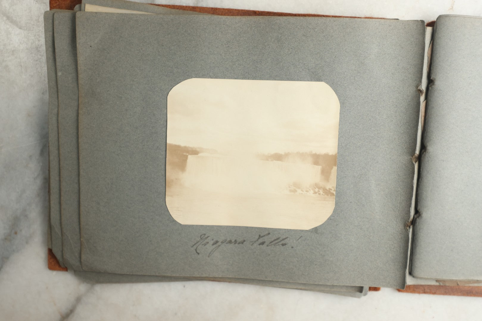 Lot 114 - Antique Snapshot Photo Album With Leather Southwestern Cover, Containing Approximately 50 Photographs With Captions, Mostly Of Travel, Including To Japan, Asia, Photo Of Ship Captain, And More, Circa 1905
