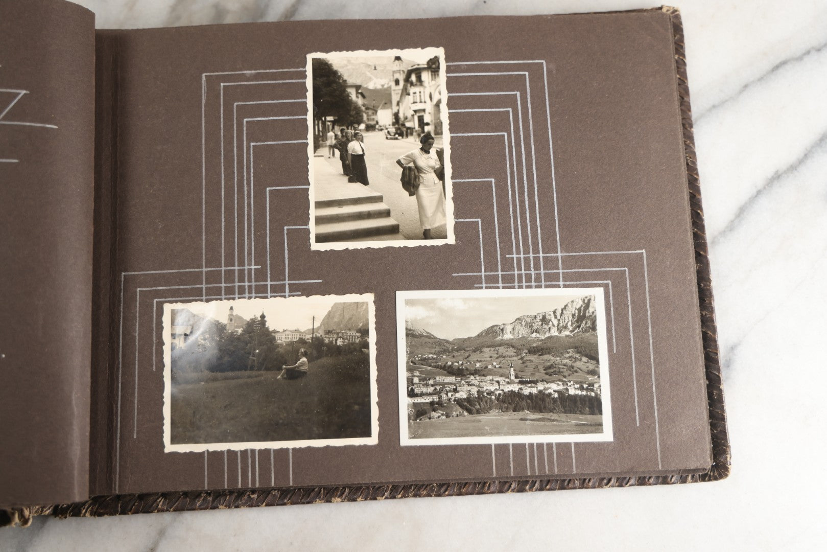 Lot 122 - Antique Snapshot Photo Album, Containing Approximately 100 Photographs With Captions In Czech, Detailed Pin Striping And Painting On Pages, Mostly Photos Of Travel Around Europe, Including Italy, The Alps, Croatia, Ukraine, And More, Circa 1920