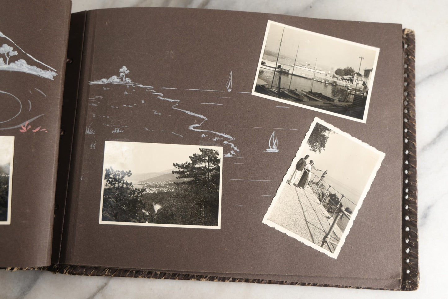 Lot 122 - Antique Snapshot Photo Album, Containing Approximately 100 Photographs With Captions In Czech, Detailed Pin Striping And Painting On Pages, Mostly Photos Of Travel Around Europe, Including Italy, The Alps, Croatia, Ukraine, And More, Circa 1920