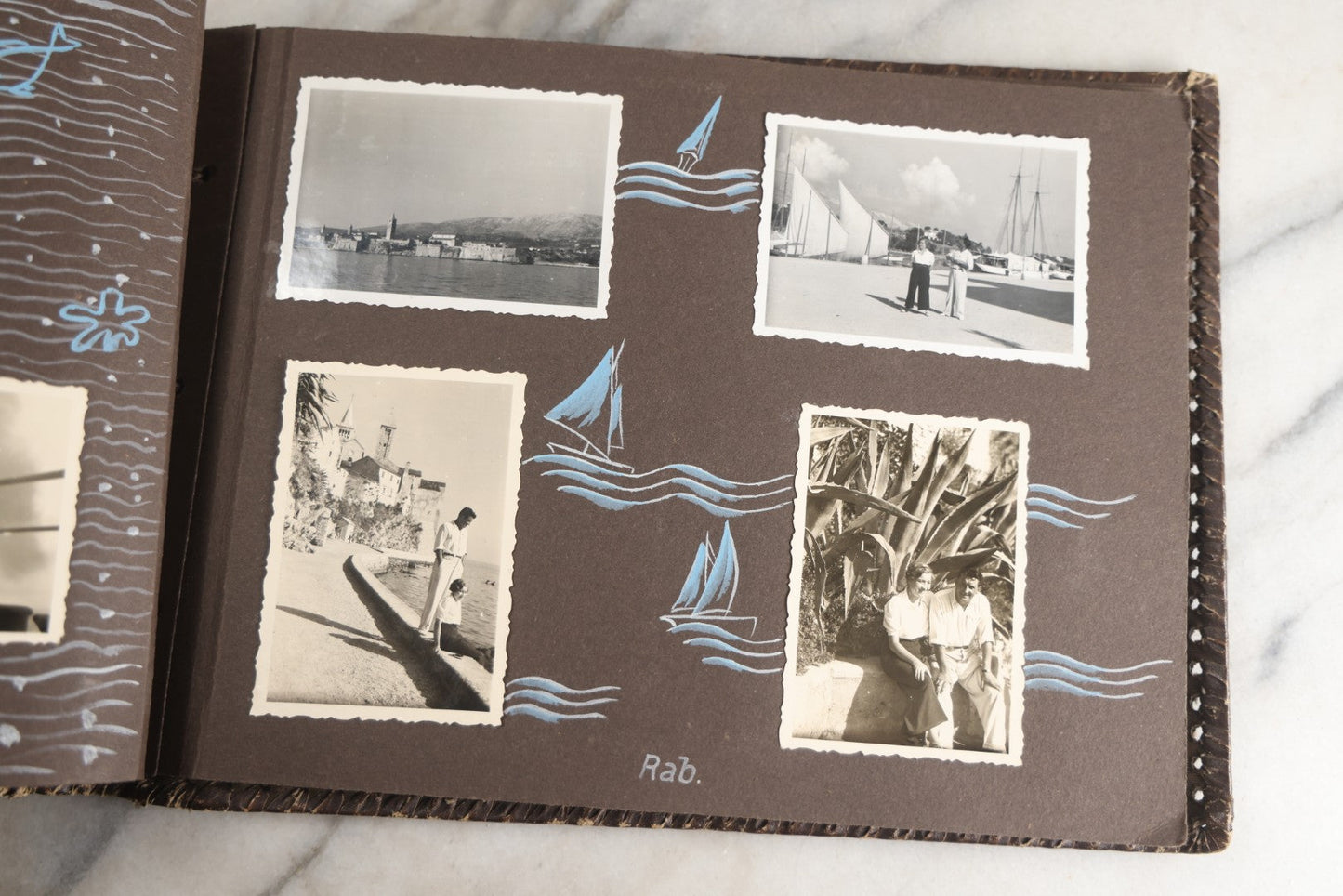 Lot 122 - Antique Snapshot Photo Album, Containing Approximately 100 Photographs With Captions In Czech, Detailed Pin Striping And Painting On Pages, Mostly Photos Of Travel Around Europe, Including Italy, The Alps, Croatia, Ukraine, And More, Circa 1920