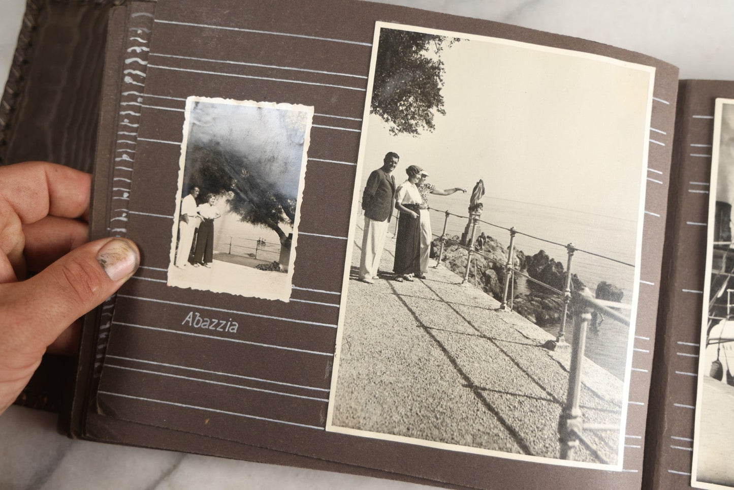 Lot 122 - Antique Snapshot Photo Album, Containing Approximately 100 Photographs With Captions In Czech, Detailed Pin Striping And Painting On Pages, Mostly Photos Of Travel Around Europe, Including Italy, The Alps, Croatia, Ukraine, And More, Circa 1920