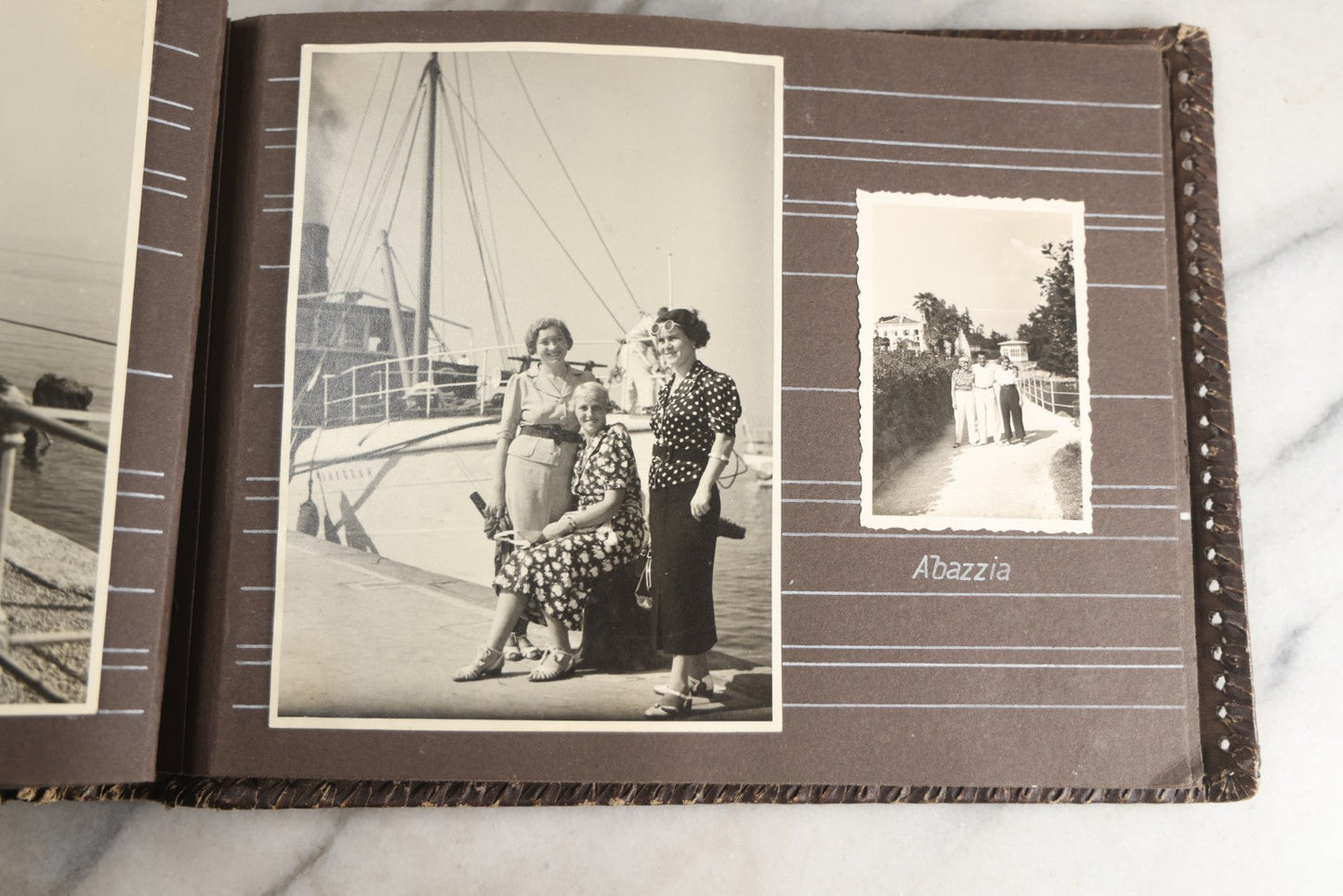 Lot 122 - Antique Snapshot Photo Album, Containing Approximately 100 Photographs With Captions In Czech, Detailed Pin Striping And Painting On Pages, Mostly Photos Of Travel Around Europe, Including Italy, The Alps, Croatia, Ukraine, And More, Circa 1920