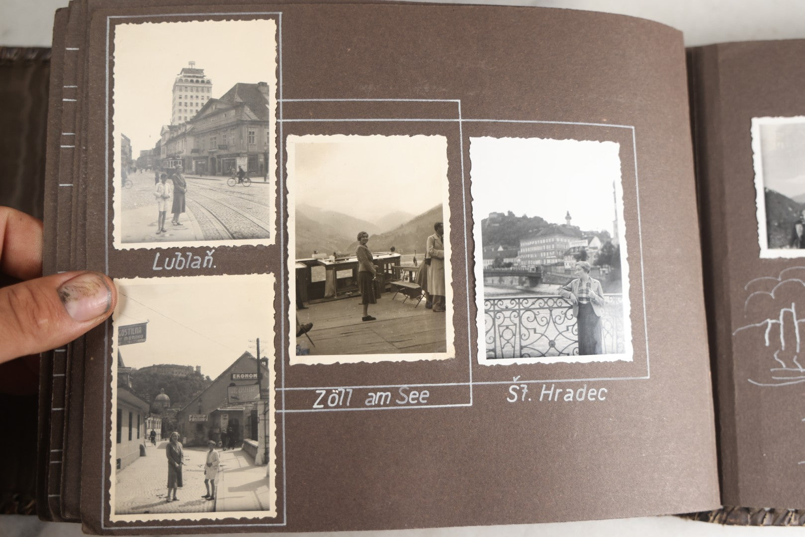 Lot 122 - Antique Snapshot Photo Album, Containing Approximately 100 Photographs With Captions In Czech, Detailed Pin Striping And Painting On Pages, Mostly Photos Of Travel Around Europe, Including Italy, The Alps, Croatia, Ukraine, And More, Circa 1920