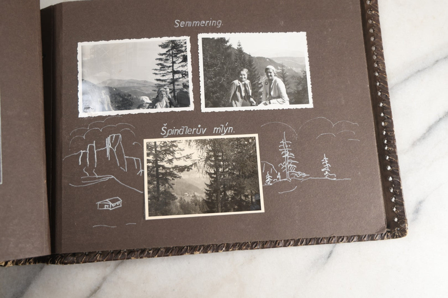 Lot 122 - Antique Snapshot Photo Album, Containing Approximately 100 Photographs With Captions In Czech, Detailed Pin Striping And Painting On Pages, Mostly Photos Of Travel Around Europe, Including Italy, The Alps, Croatia, Ukraine, And More, Circa 1920