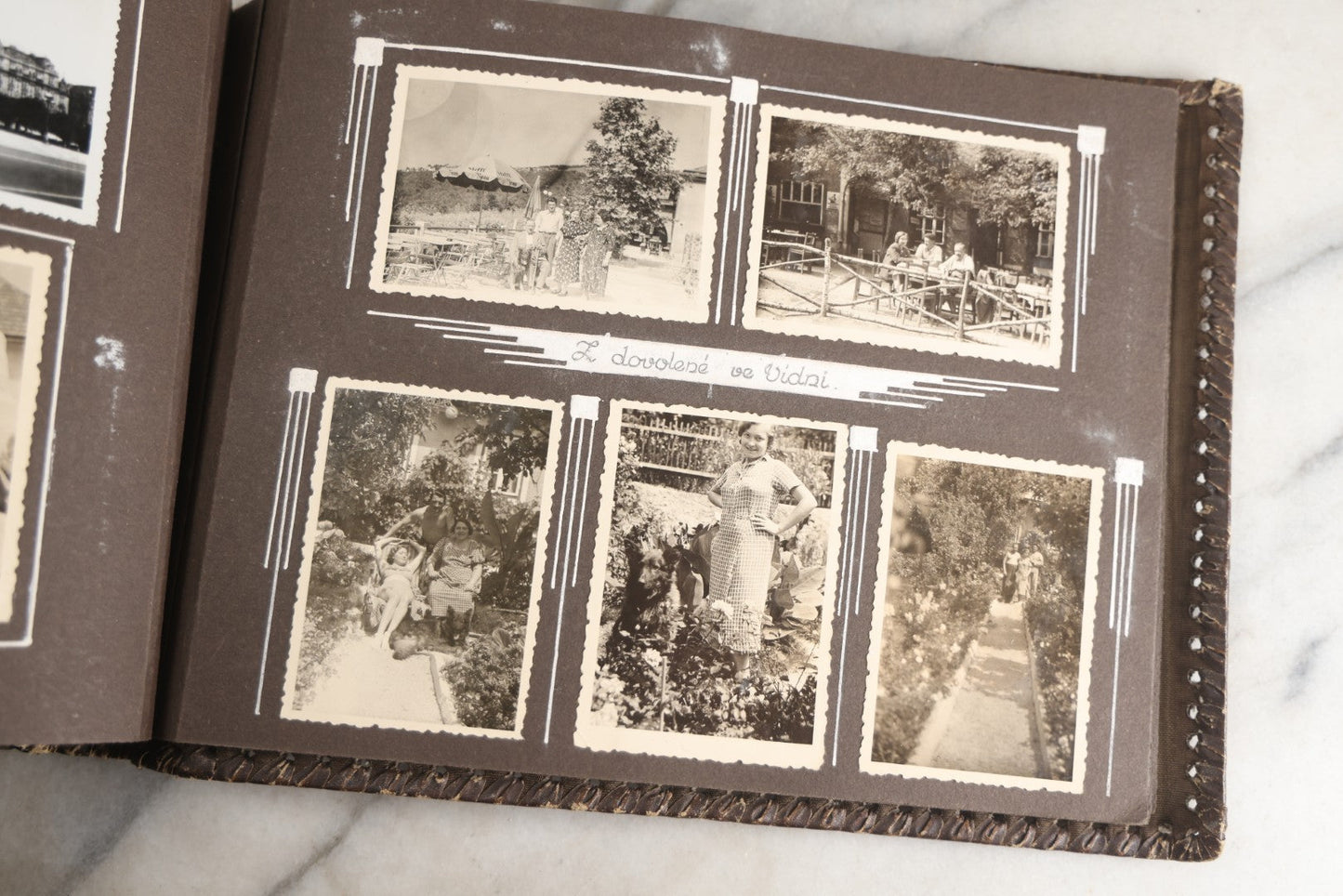 Lot 122 - Antique Snapshot Photo Album, Containing Approximately 100 Photographs With Captions In Czech, Detailed Pin Striping And Painting On Pages, Mostly Photos Of Travel Around Europe, Including Italy, The Alps, Croatia, Ukraine, And More, Circa 1920