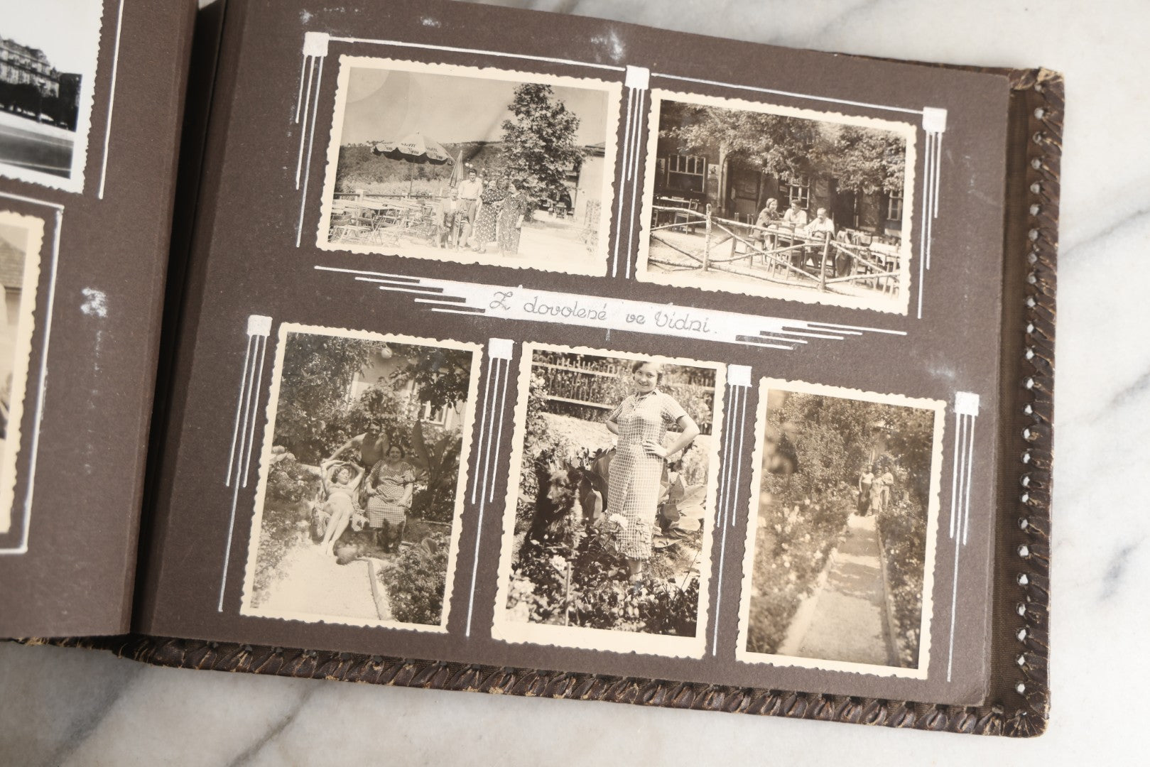 Lot 122 - Antique Snapshot Photo Album, Containing Approximately 100 Photographs With Captions In Czech, Detailed Pin Striping And Painting On Pages, Mostly Photos Of Travel Around Europe, Including Italy, The Alps, Croatia, Ukraine, And More, Circa 1920