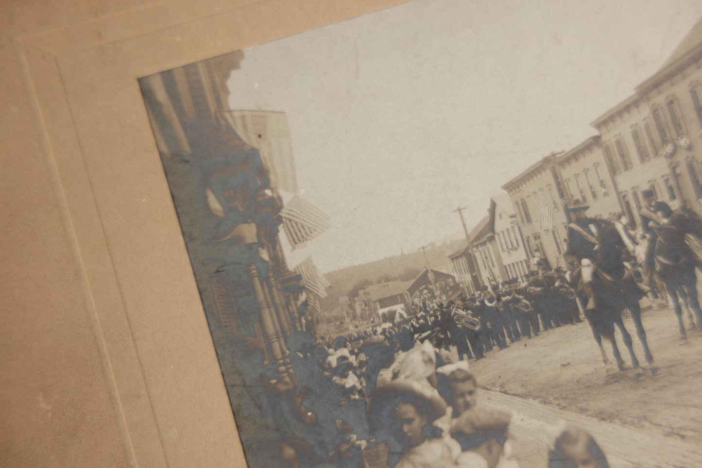 Lot 123 - Antique Boarded Photograph Of A Parade, Likely Fourth Of July, Including Man In Uncle Sam Costume Horseback Mounted Military, Onlookers, American Flags, Downtown Area, Possibly Baltimore Maryland, Verso Marked John Hopkins