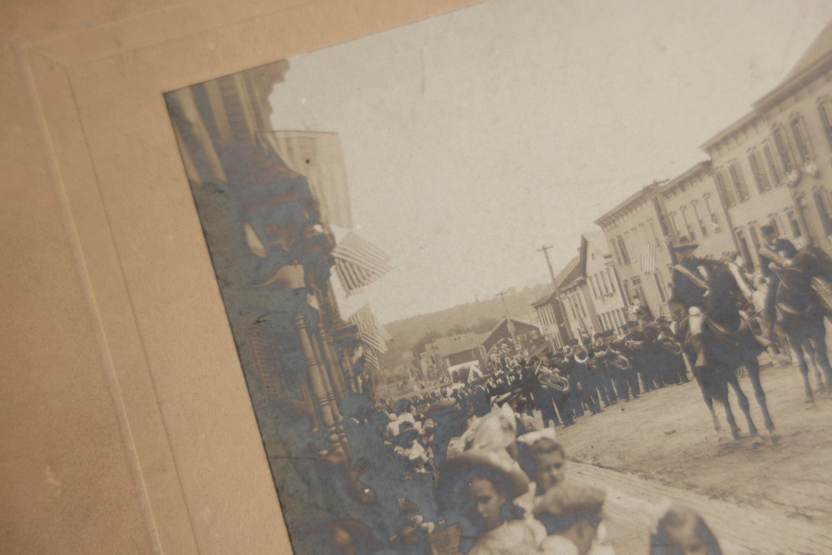 Lot 123 - Antique Boarded Photograph Of A Parade, Likely Fourth Of July, Including Man In Uncle Sam Costume Horseback Mounted Military, Onlookers, American Flags, Downtown Area, Possibly Baltimore Maryland, Verso Marked John Hopkins