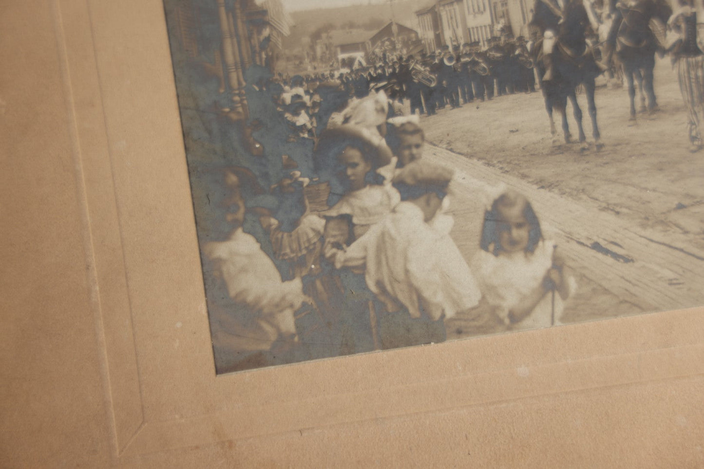Lot 123 - Antique Boarded Photograph Of A Parade, Likely Fourth Of July, Including Man In Uncle Sam Costume Horseback Mounted Military, Onlookers, American Flags, Downtown Area, Possibly Baltimore Maryland, Verso Marked John Hopkins