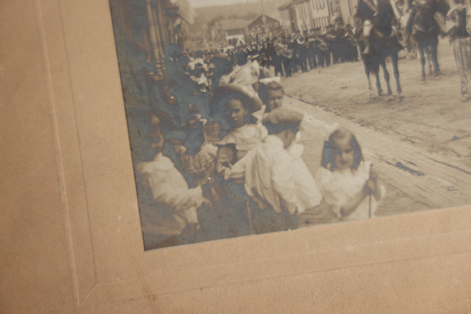 Lot 123 - Antique Boarded Photograph Of A Parade, Likely Fourth Of July, Including Man In Uncle Sam Costume Horseback Mounted Military, Onlookers, American Flags, Downtown Area, Possibly Baltimore Maryland, Verso Marked John Hopkins