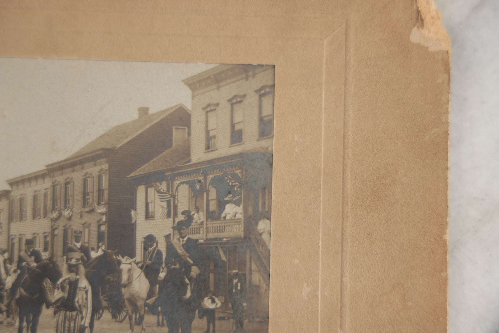Lot 123 - Antique Boarded Photograph Of A Parade, Likely Fourth Of July, Including Man In Uncle Sam Costume Horseback Mounted Military, Onlookers, American Flags, Downtown Area, Possibly Baltimore Maryland, Verso Marked John Hopkins