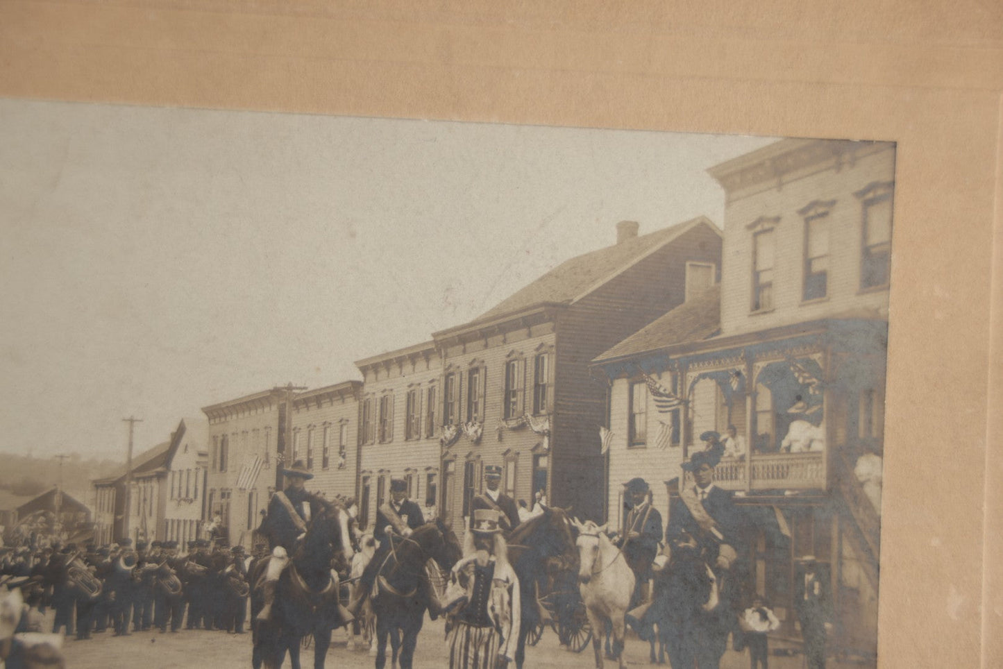 Lot 123 - Antique Boarded Photograph Of A Parade, Likely Fourth Of July, Including Man In Uncle Sam Costume Horseback Mounted Military, Onlookers, American Flags, Downtown Area, Possibly Baltimore Maryland, Verso Marked John Hopkins