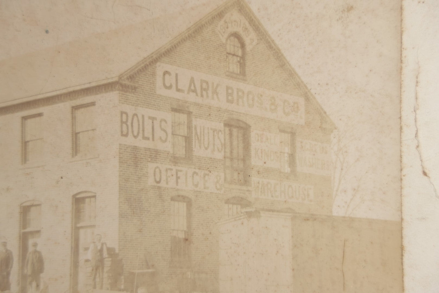 Lot 124 - Antique Boarded Occupational Photograph Of The Clarke Bros & Co. Bolts And Nuts Office And Warehouse Building With Train Car, Cattle, Horses, And Workers In Frame