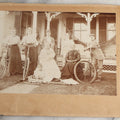 Lot 126 - Antique Boarded Photograph Of Men And Women Posing With Bicycles In Front Of Porch With Hammock, Identified On Verso