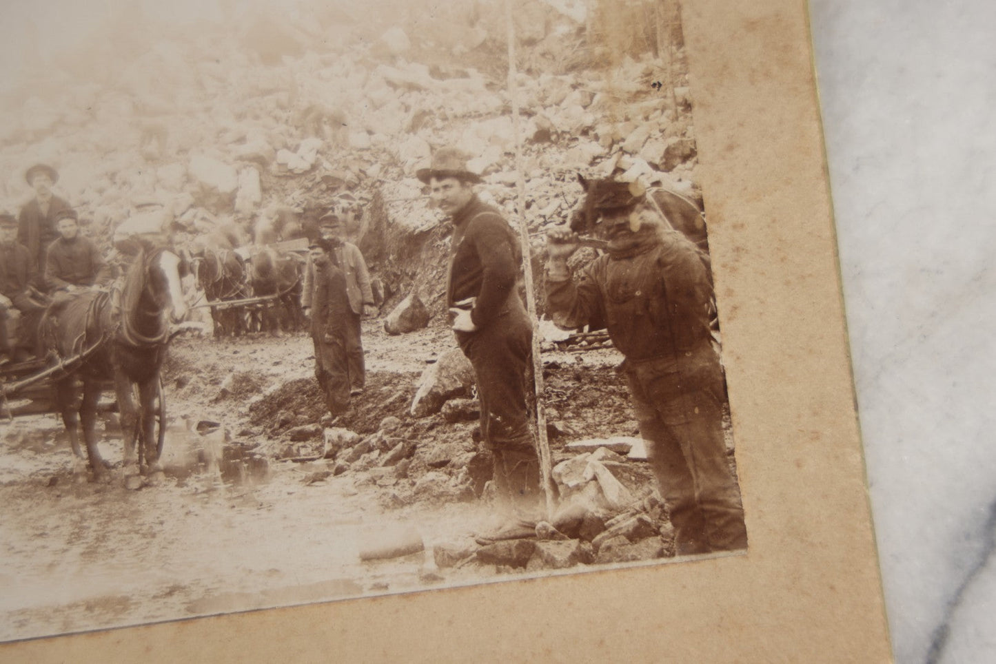 Lot 128 - Antique Boarded Occupational Photograph Of Loggers At Work, Many Horses In Frame