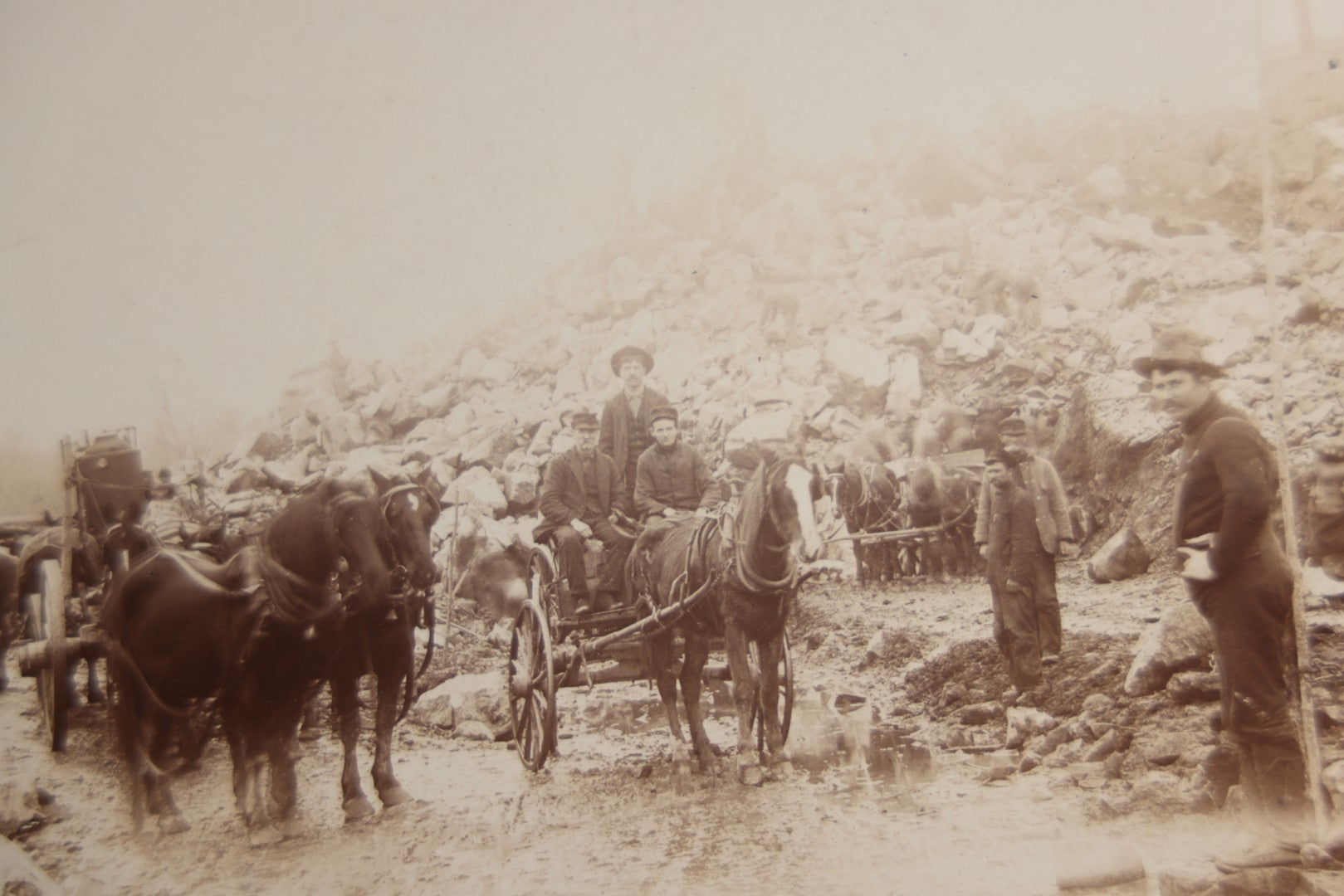 Lot 128 - Antique Boarded Occupational Photograph Of Loggers At Work, Many Horses In Frame