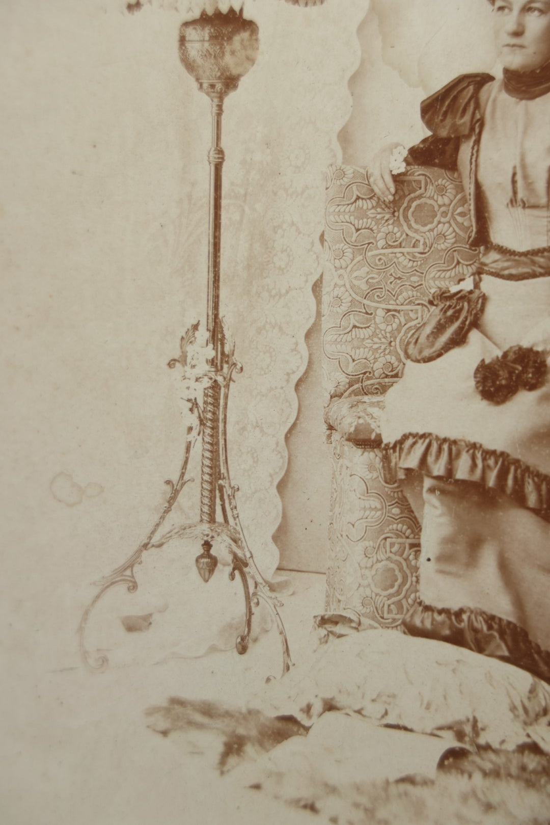 Lot 130 - Antique Boarded Photograph Of A Well Dressed Woman Posing On An Elaborate Set With Piano Lamp
