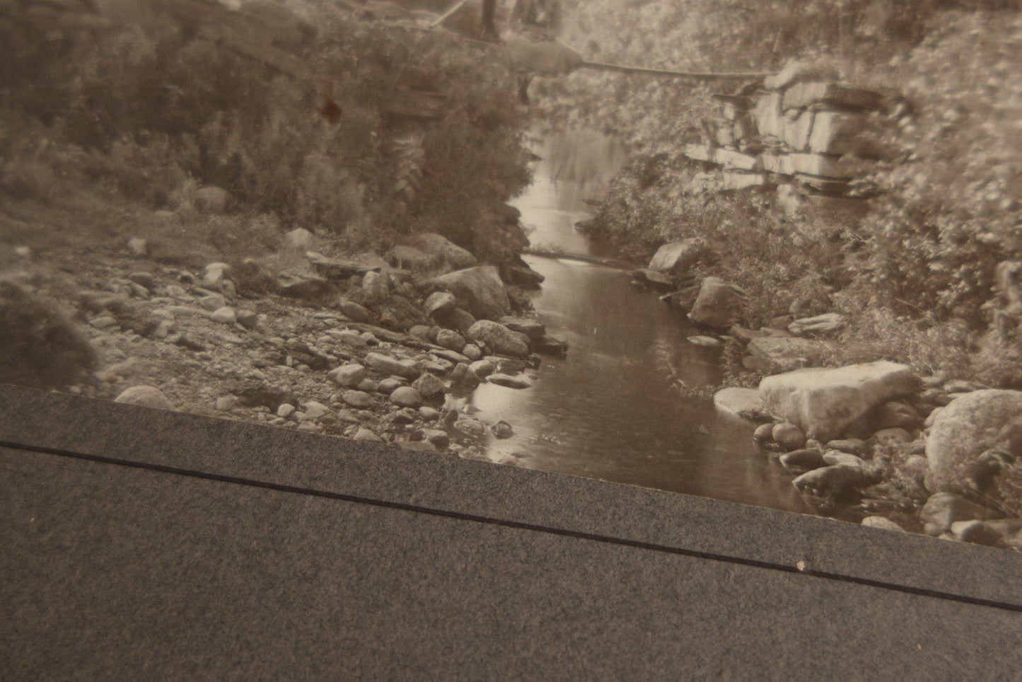 Lot 131 - Pair Of Antique Boarded Photographs Of Outdoor Scenes, Including Boy And Girl On Primitive Stick Bridge Crossing Creek, Canoe