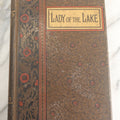 Lot 134 - "The Lady Of The Lake" Antique Poetry Book By Sir Walter Scott, Illustrated, Decorative Brown Cloth Boards With Red And Black Floral And Scroll Design, Gilt Title Panel, Nims & Knight, Publishers, Troy, N.Y., 1884