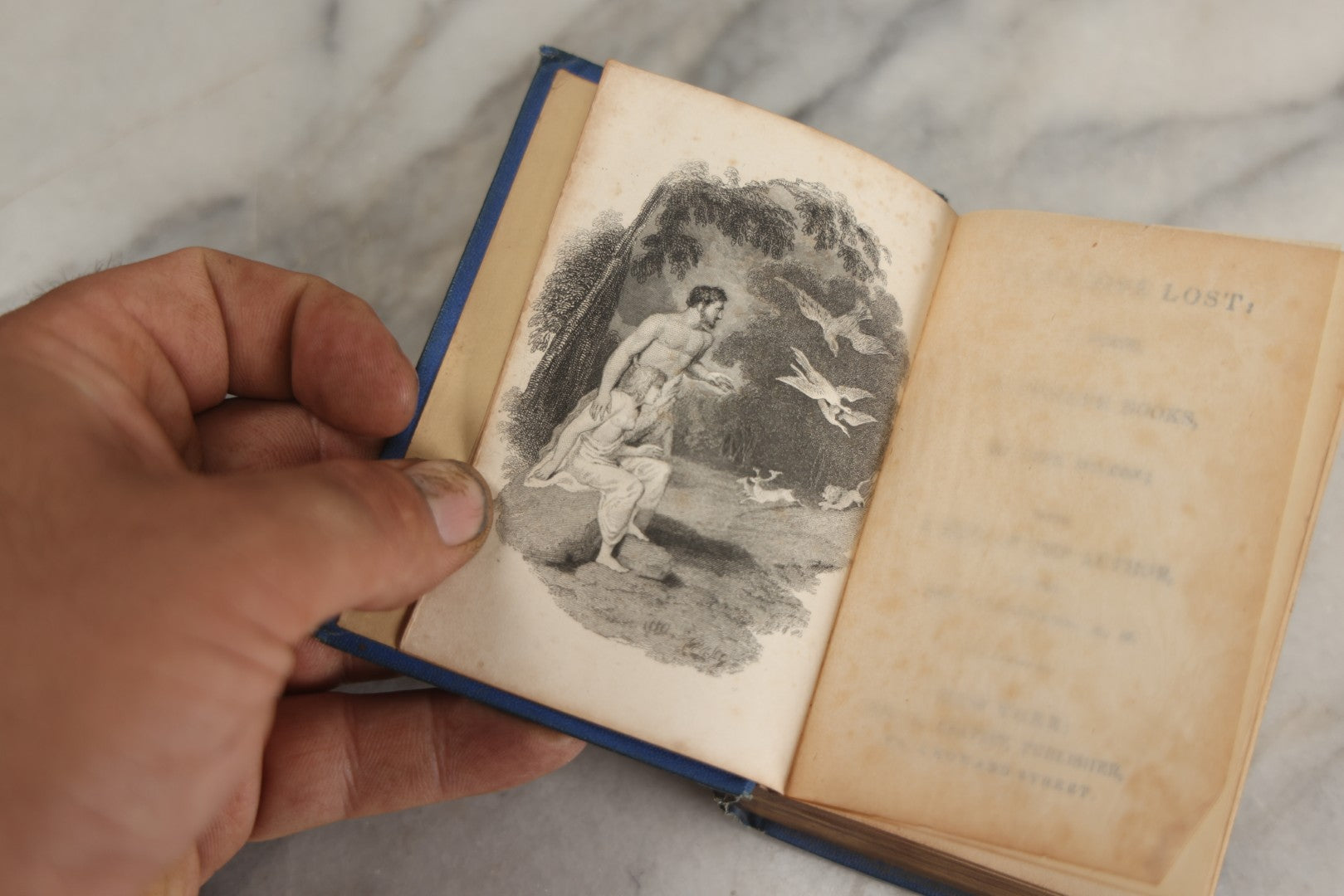 Lot 135 - "Paradise Lost" Antique Miniature Book By John Milton, With A Life Of The Author By Rev. H. Stebbing, Engraved Frontispiece, Decorative Blue Cloth Boards With Gilt "Milton" Cartouche And Shield, Geo. A. Leavitt, Publisher, New York, Circa 1860s