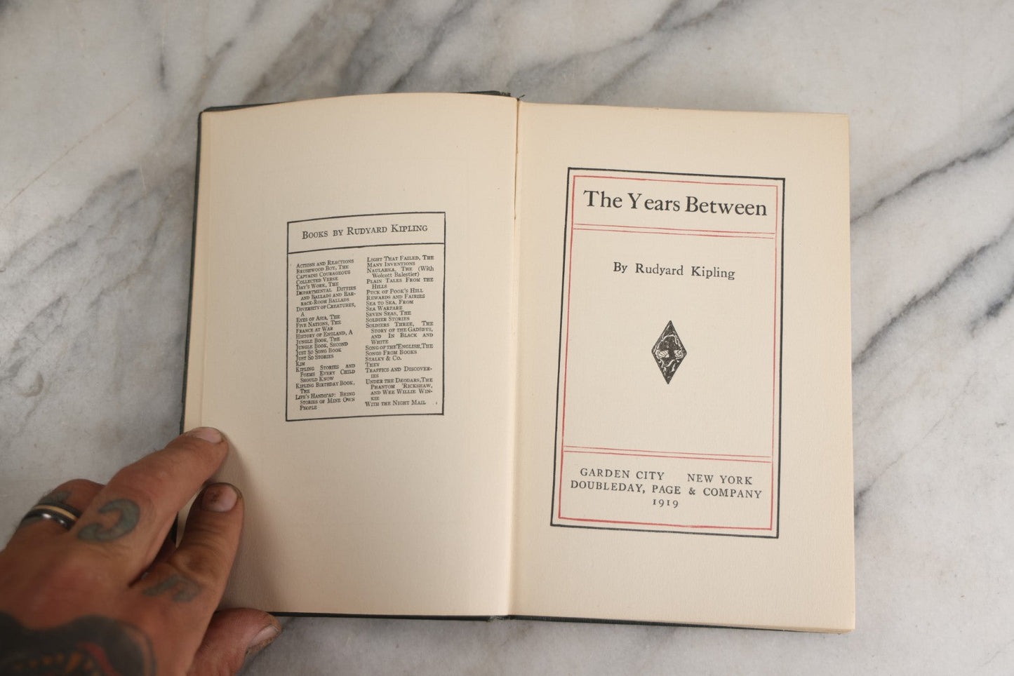 Lot 139 - "The Years Between" Antique Poetry Book By Rudyard Kipling, Green Cloth Boards With Gilt Title And Black Pictorial Sailing Ship Motif, Doubleday, Page & Company, Garden City, New York, 1919