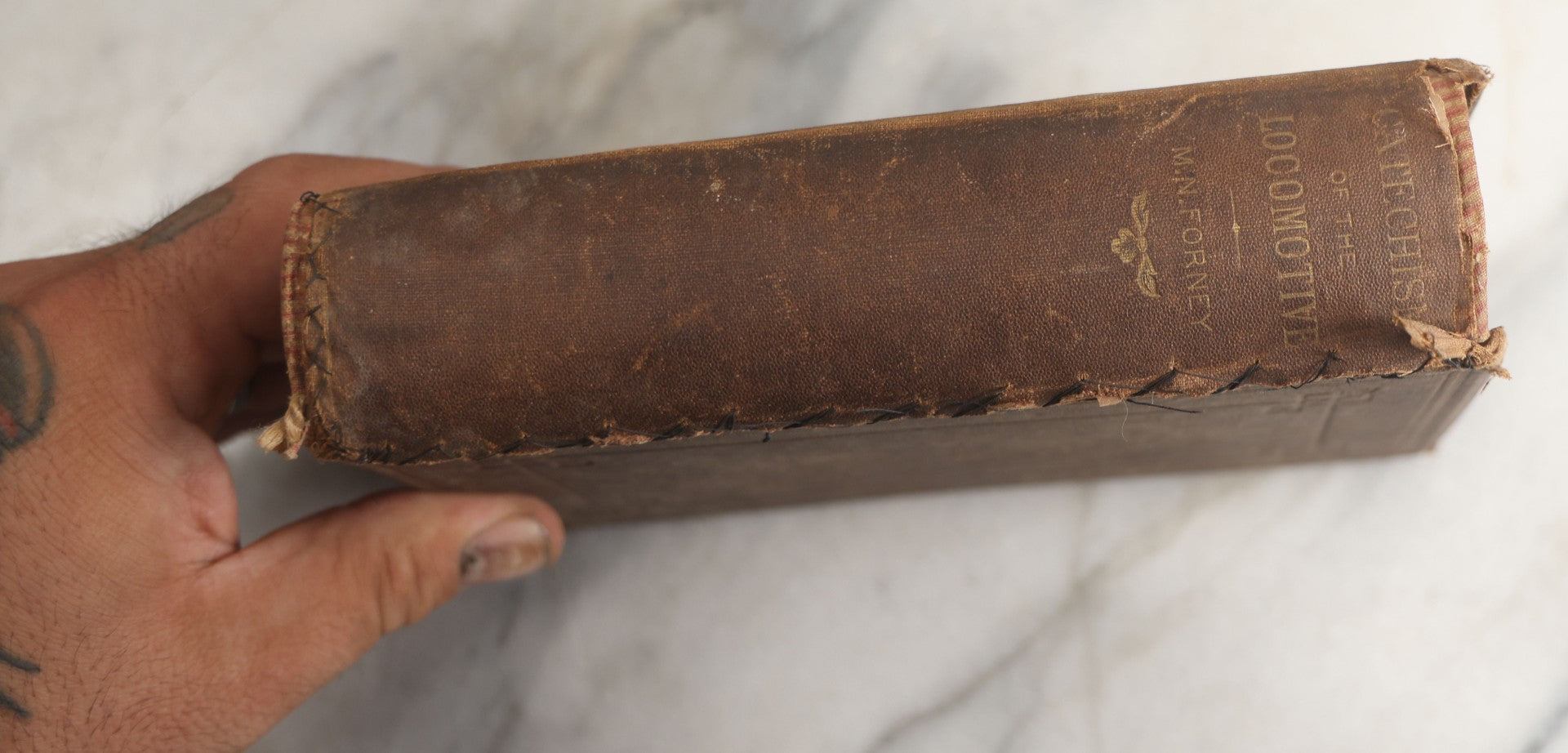 Lot 177 - "Catechism Of The Locomotive" Antique Railroad Engineering Book By Matthias Nace Forney, Brown Cloth Boards With Gilt Spine Titles, Note Significant Wear To Spine And Edges, Title Page Missing, Circa Late 19th Century